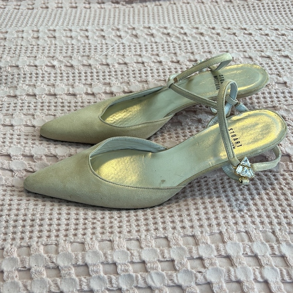 Stuart Weitzman kitten heel pumps with jewel buckle.